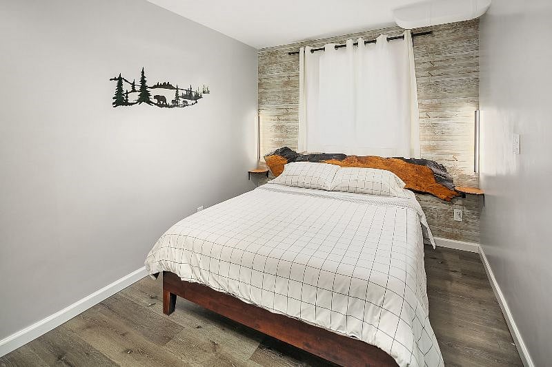 Bedroom #2 - Queen size Leesa Mattress

- 40" Samsung Smart TV (wall mounted)

- Electric fireplace

- A small closet

- Tastefully decorated with a live-edge maple headboard, floating pine bedside shelves and wall mounted reading lamps.