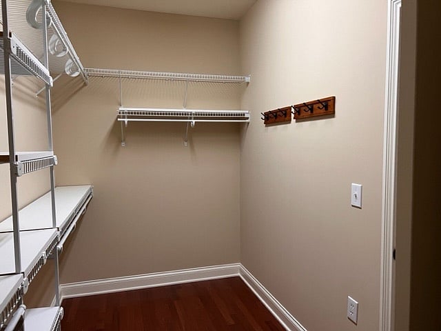 Opposte side of master closet 2 of 2 photos