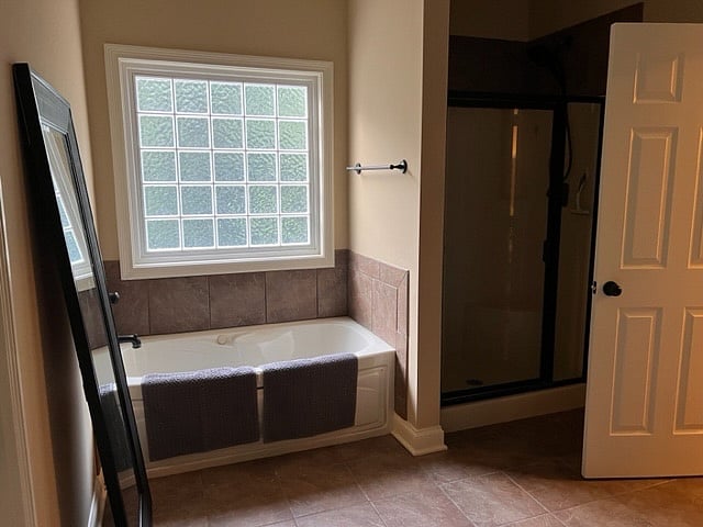 Jacuzzi bathtum and stand up shower in master bedroom