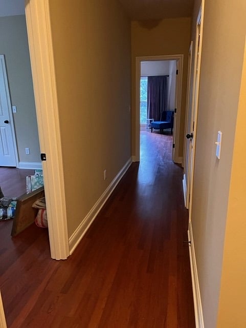 hallway to middle bonus room with desk