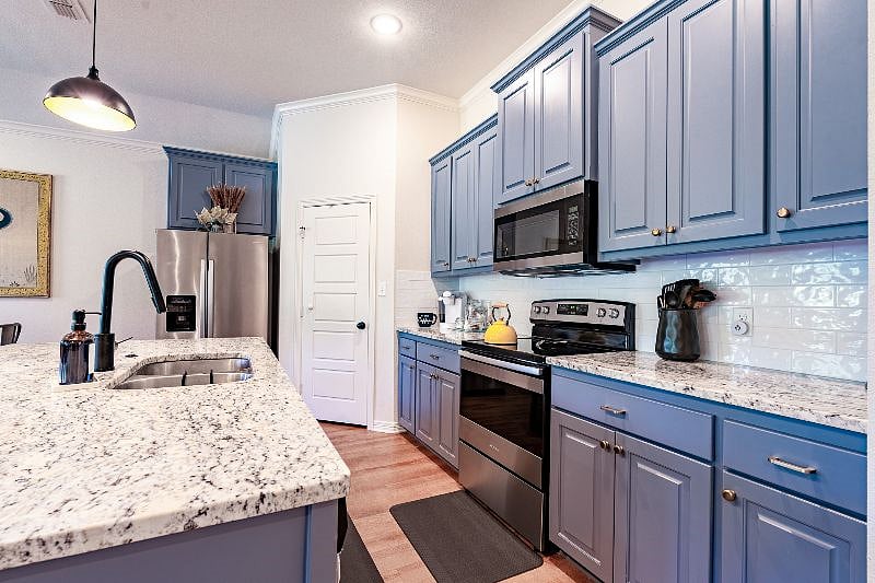 Photo shows kitchen and walk-in pantry.