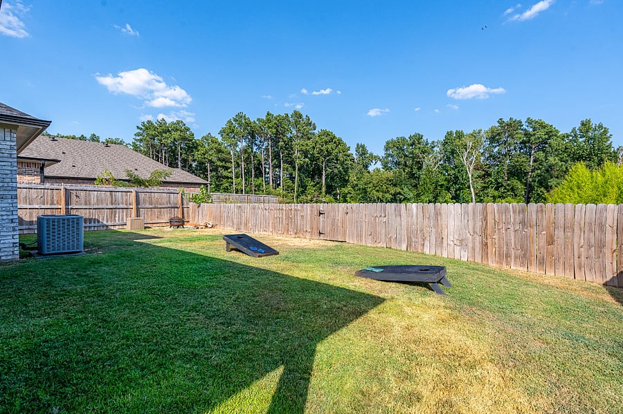Beautiful views of an open field with tall trees. Lawn games including cornhole and Connect Four provided.