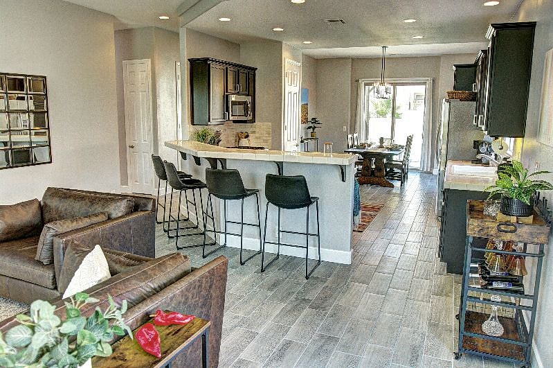 Spacious bright living area with pool and patio access