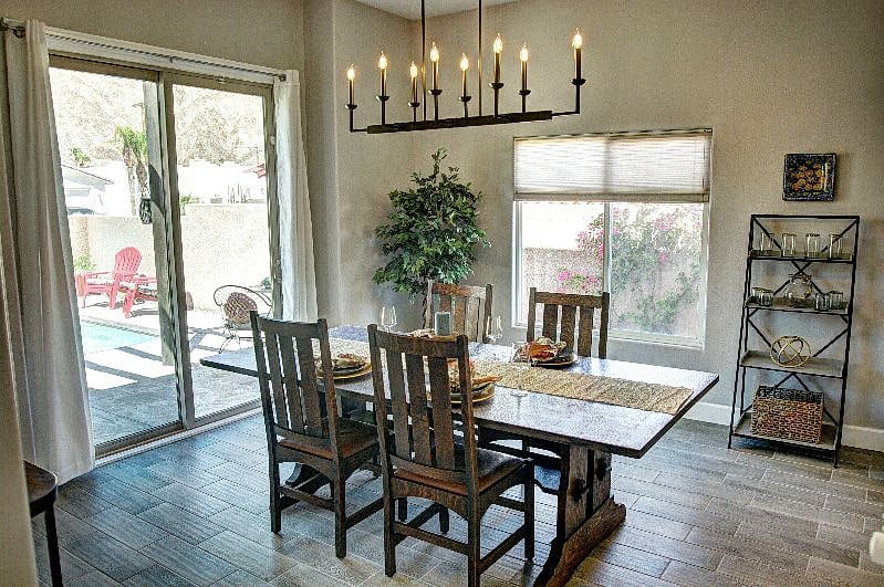 Spacious and open dining room with views of pool and mountains