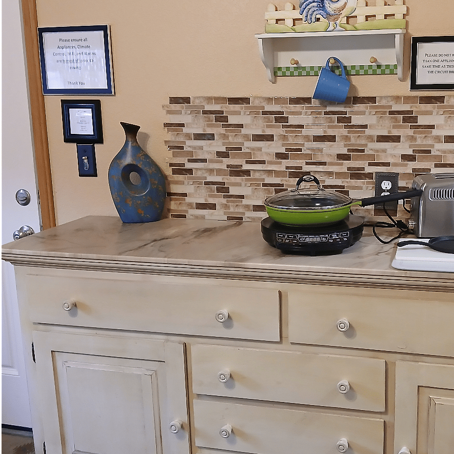 Kitchen has full size Refrigerator, microwave, and convection oven, induction cook top. toaster and coffee pot, and more