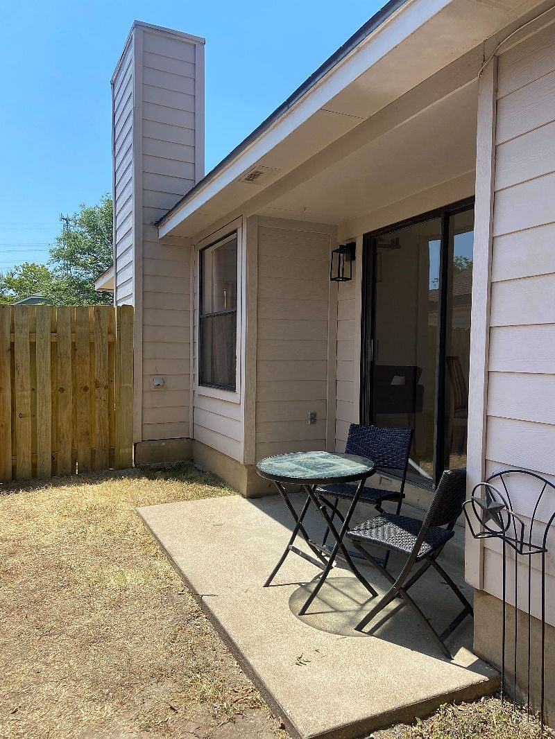 Patio with a small fenced in side yard