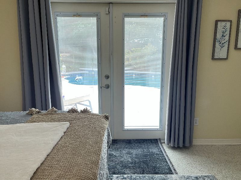 Wake-up to a view of our gorgeous pool and beautifully landscaped backyard.