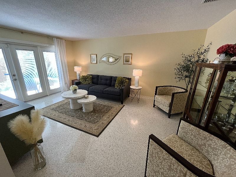 Welcome to our spacious living room, with plenty of seating for movies, game night, or chatting while enjoying your favorite beverage.