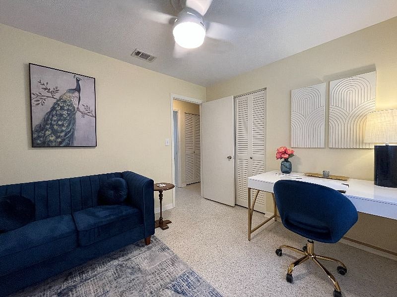 The blue velvet sofa is a great when you need a change of pace from sitting at the desk.