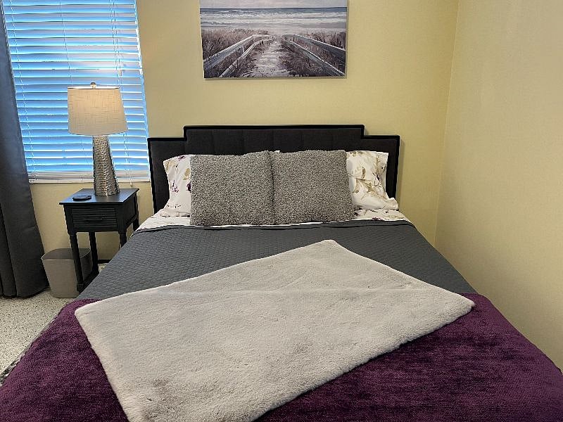 Another queen sized bed with beautiful and comfortable furnishings.