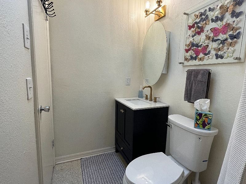 The medicine cabinet and vanity allow for ample storage.