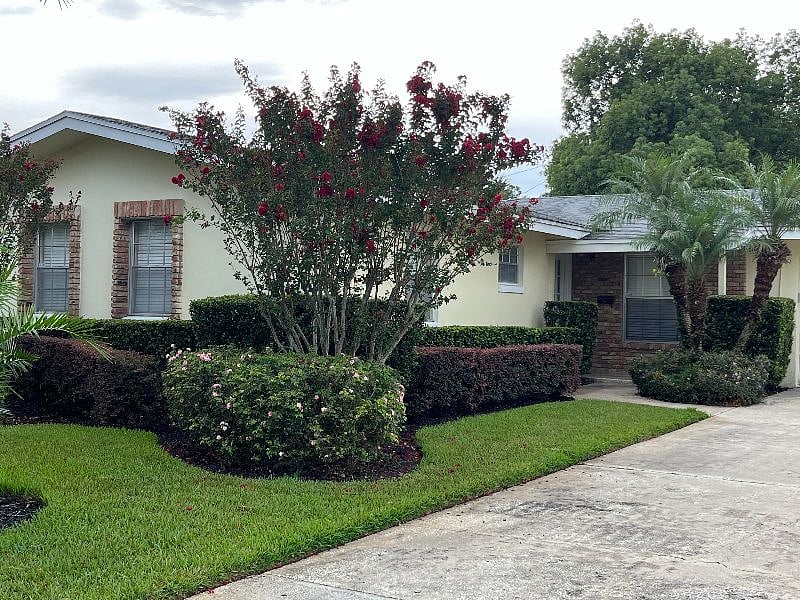 There is a generous driveway with a 2 car garage is convenient, but also protects your car from the hot Florida sun.