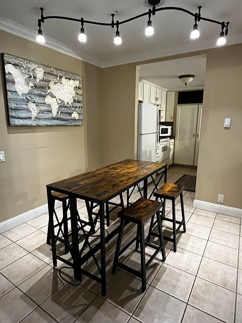 Smart tables can be rearranged and can seat 4 to 6 for dining. (Old kitchen appliances in view)