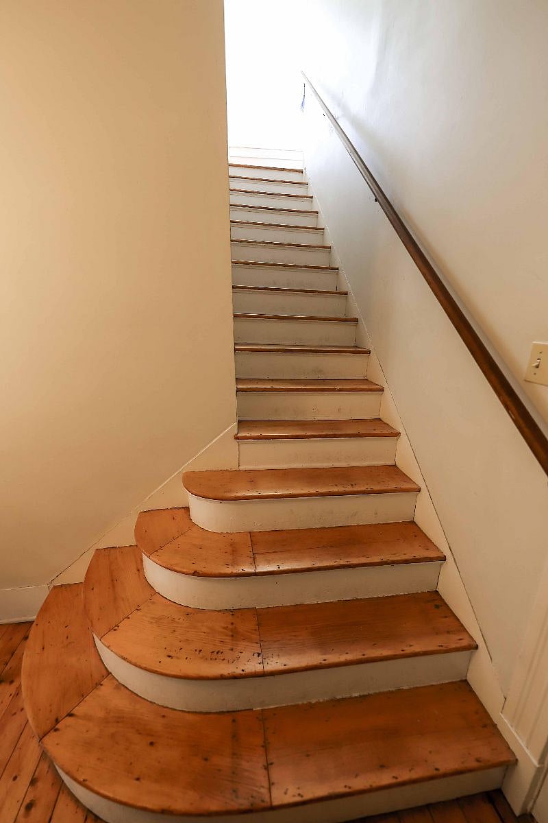 First-floor entrance leads to stairs to second-floor unit