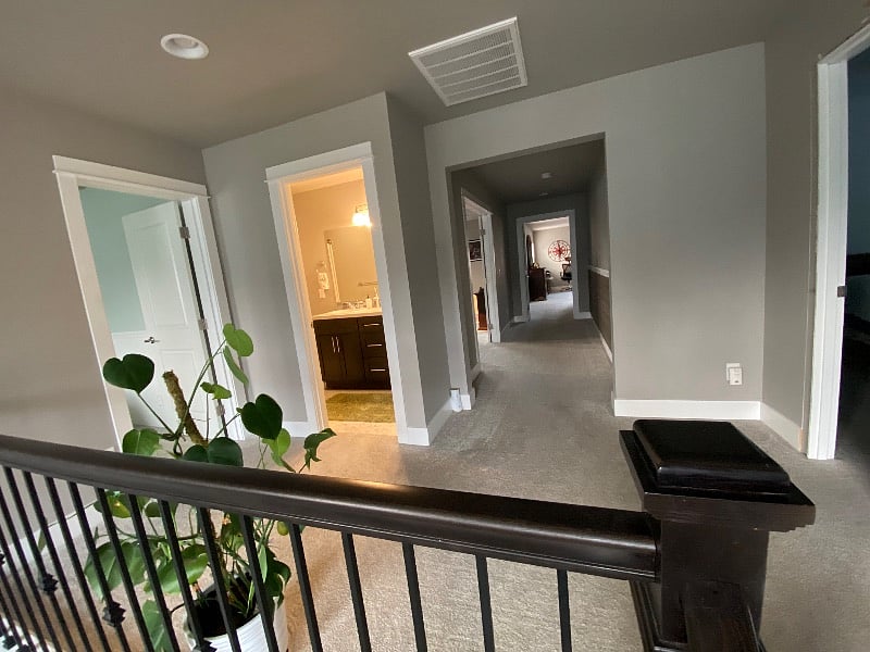 Heading upstairs to the landing between the two rooms and bathroom.