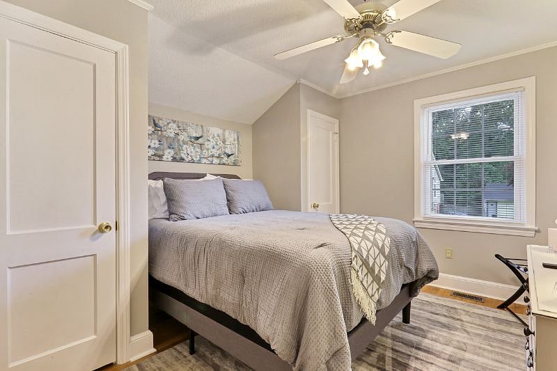 Here you can enjoy the comforts of the queen sized bed. There's no shortage of storage space here with his and her closets. Linens can also be found just behind the entry door.
