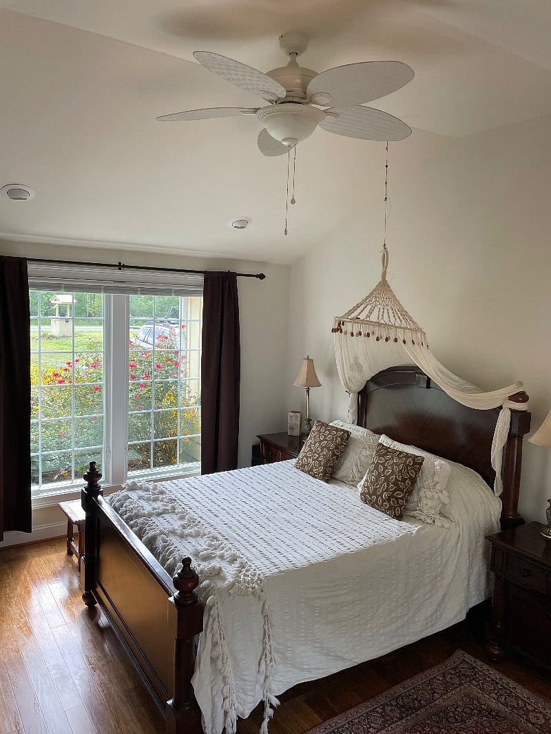 Master bedroom with vaulted ceiling and ceiling fan