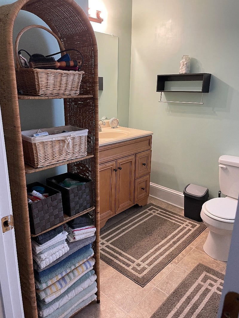 Full bathroom with tub and shower located off hall 