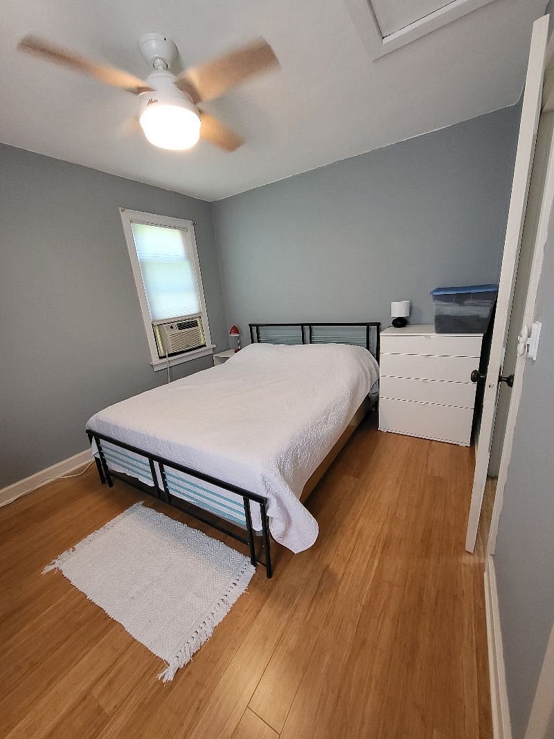 bedroom with queen sized bed and small closet