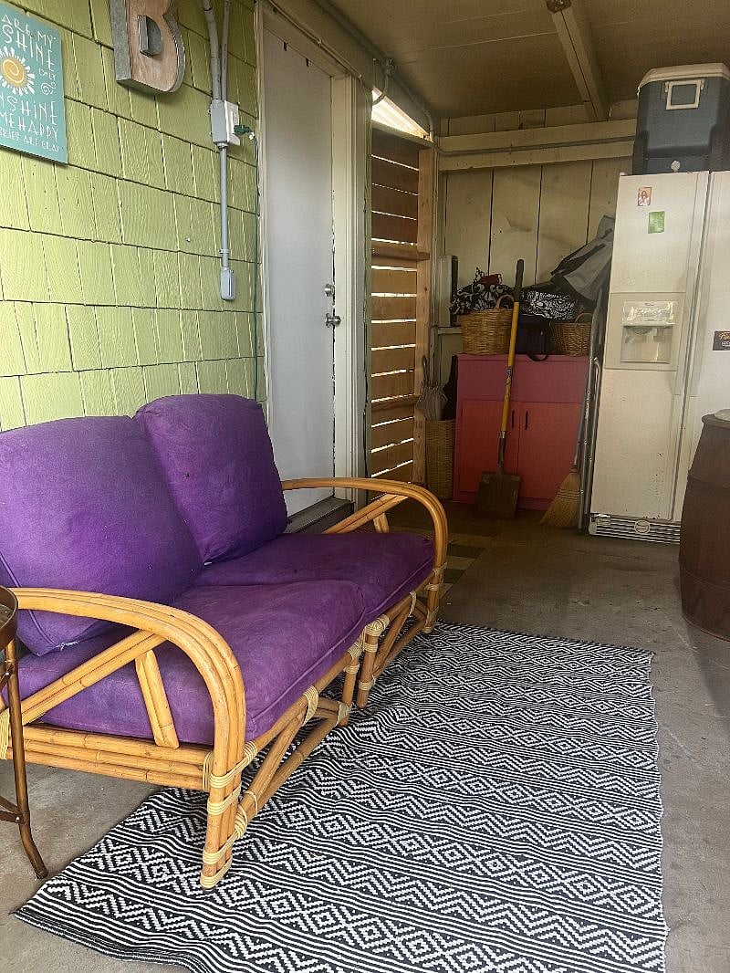 Covered seating area near back door - Full sized fridge for tenant use