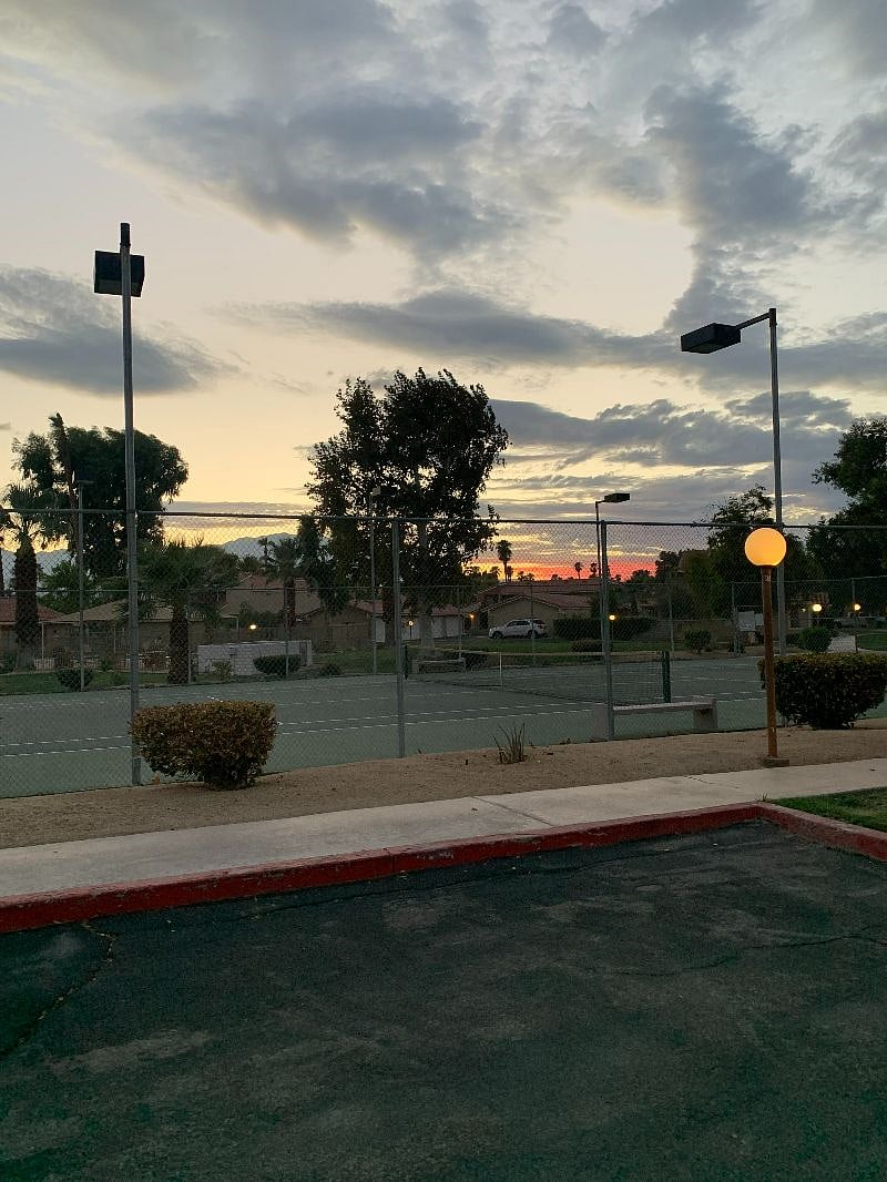 Tennis court at the end of the driveway, close to condo