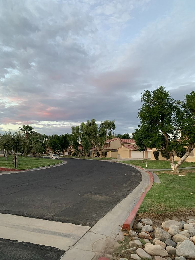 Drive through a quiet community to the condo