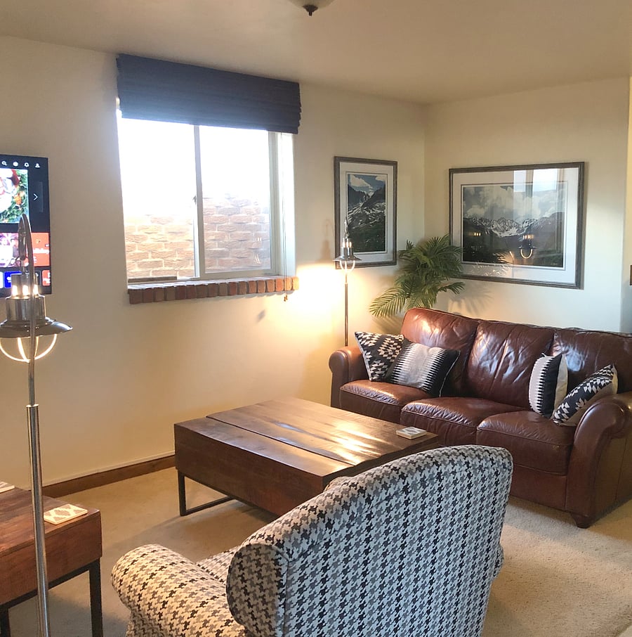 Comfortable leather couch and wing backed chairs.