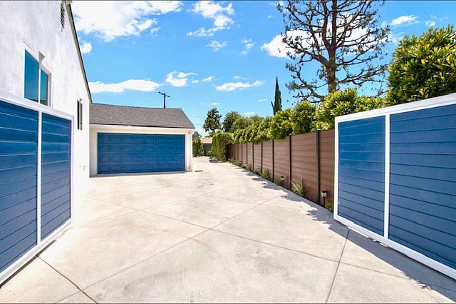 Secured electric driveway with gates, 2 car garage, EV charger.
