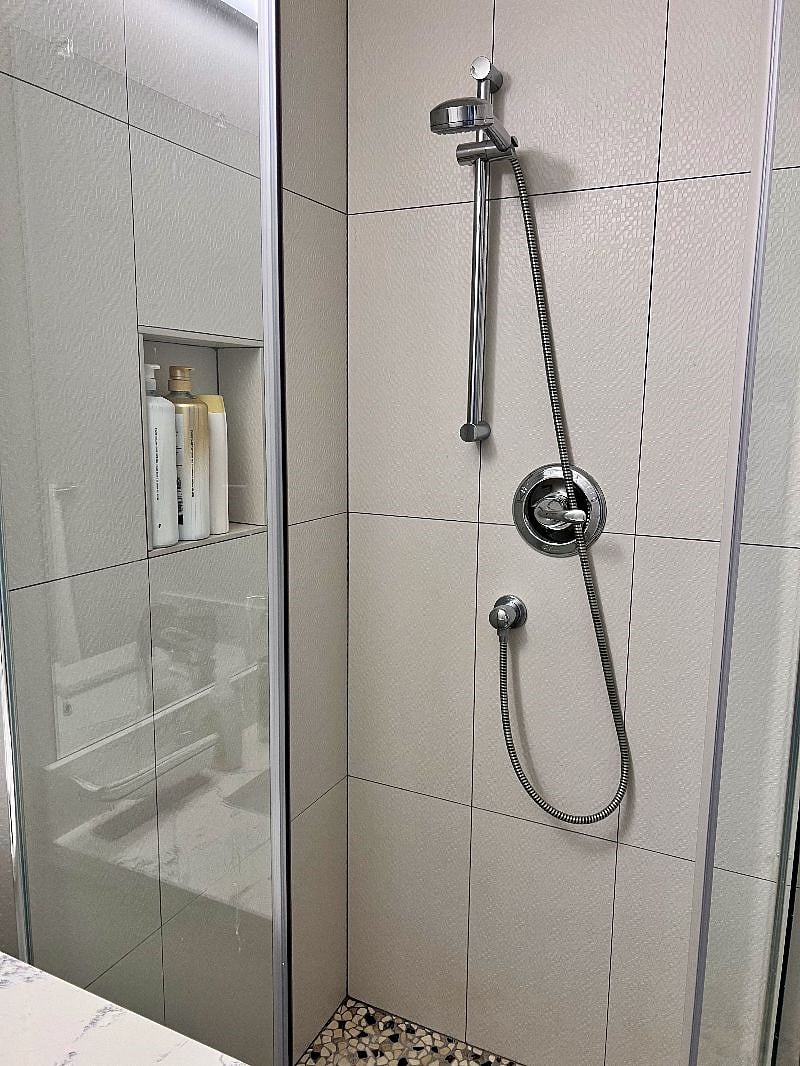 Both bathrooms have shower heads, shampoo, conditioner, and body wash
