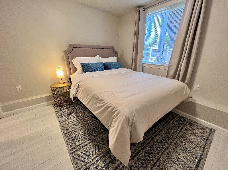 Bedroom 2 is spacious with a queen size bed and full bath ensuite. Blackout curtains and sound machine for a good night's rest.