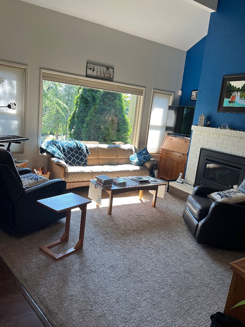 Shared living room with gas fireplace. 