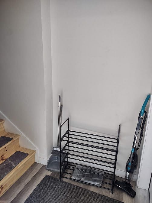 3-tier shoe rack as well as an over the door coat rack at entrance.