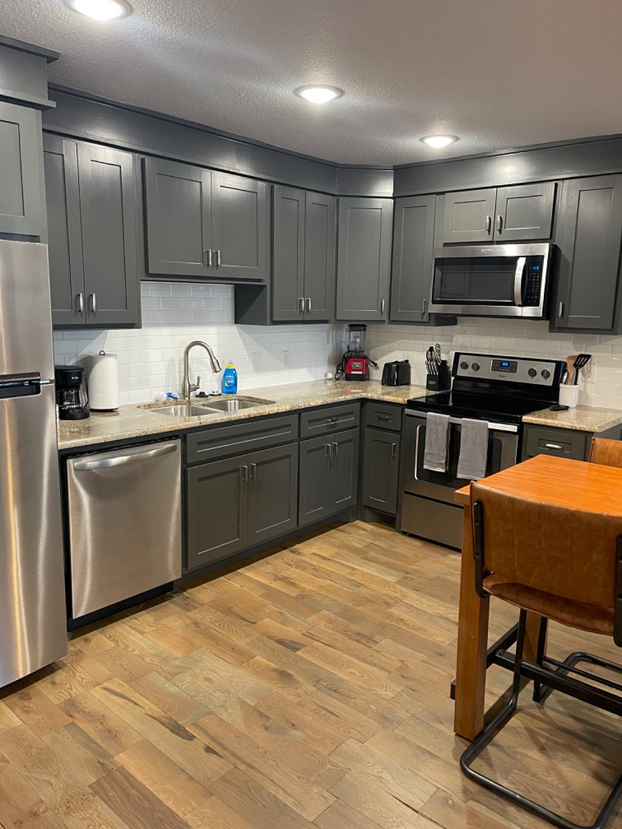 Kitchen with Mid Size Fridge, Dishwasher, Oven, and Microwave.