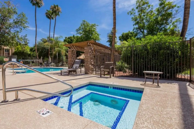 Jacuzzi next to pool entrance