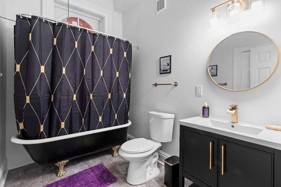 The bathroom is inviting with an original clawfoot tub, new fixtures and a large linen closet.