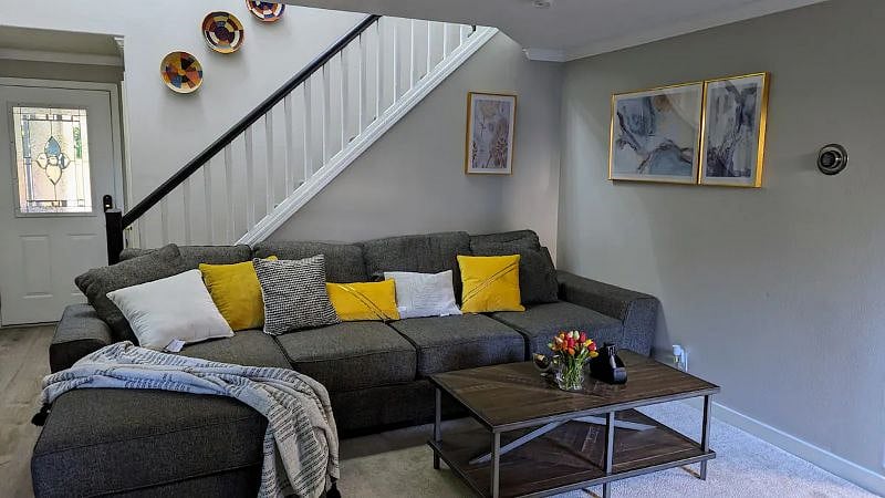 Spacious living area with TV and pull-up bed for added comfort
