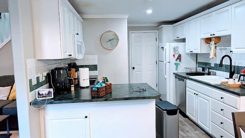 Prepare culinary delights in our fully equipped kitchen for a delightful stay.
