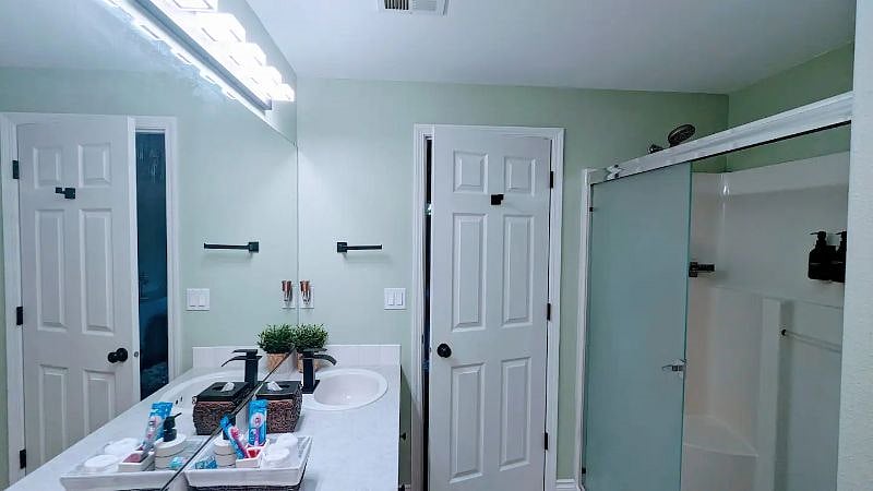 Bathe in natural light and tranquility in the master bathroom with a stunning ceiling window.