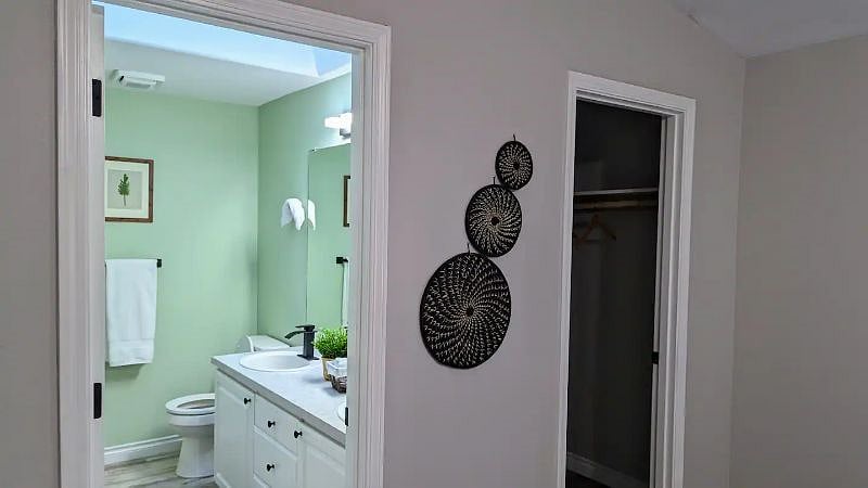 Ensuite bathroom and spacious walk-in closet for the master bedroom.