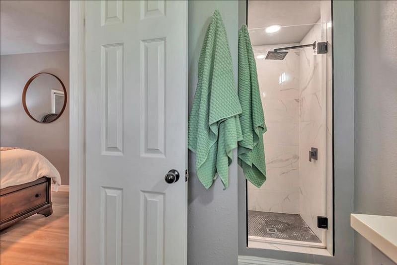 Master ensuite: Shower, sink storage, modern luxury.