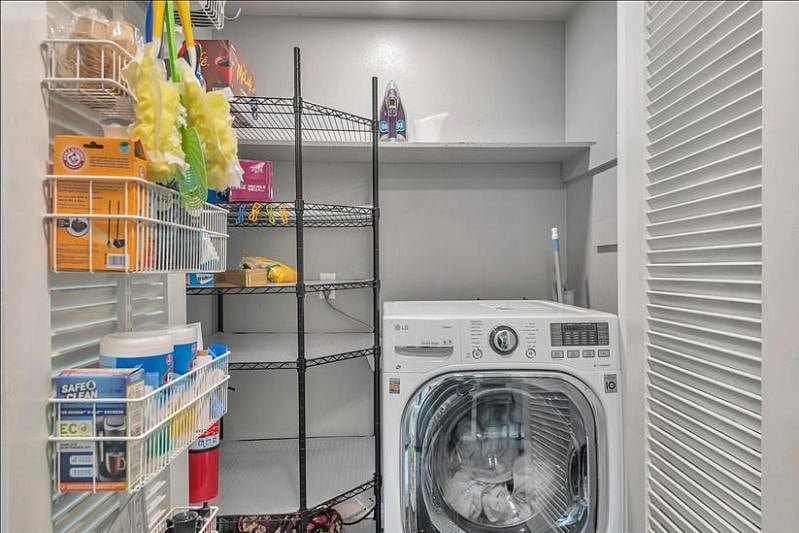 Efficient pantry: Single unit washer/dryer, concealed convenience.