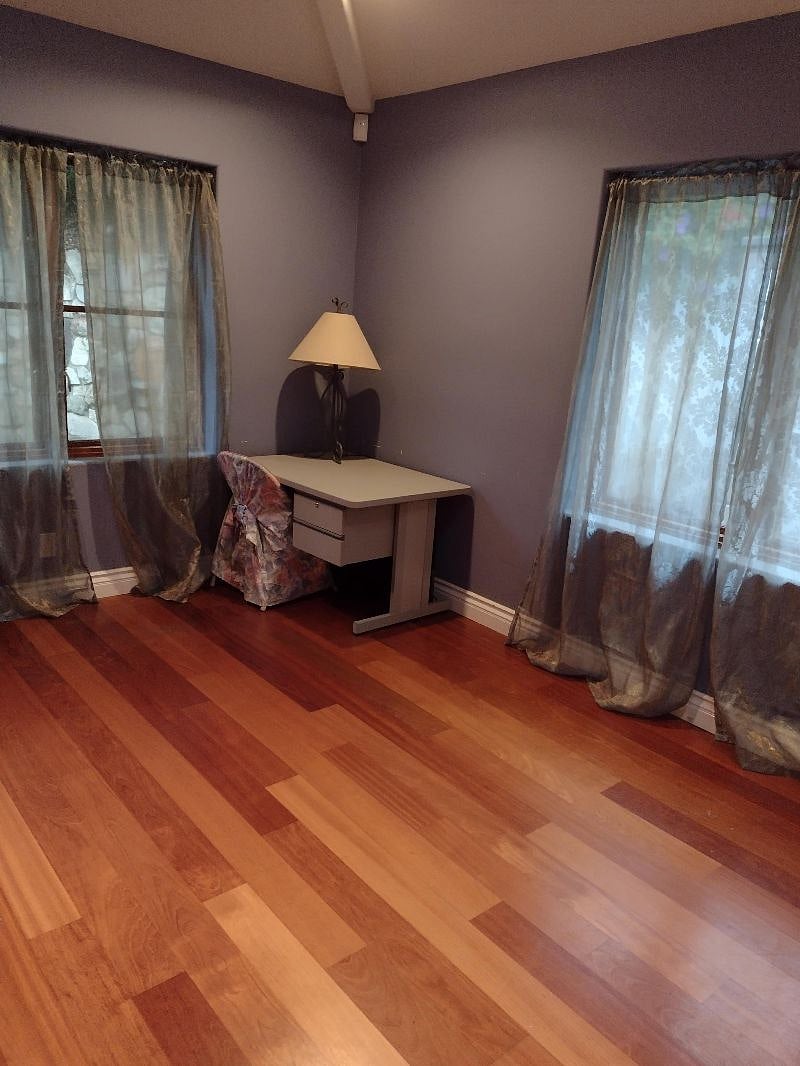1st floor private bedroom with double bed, desk, closet.