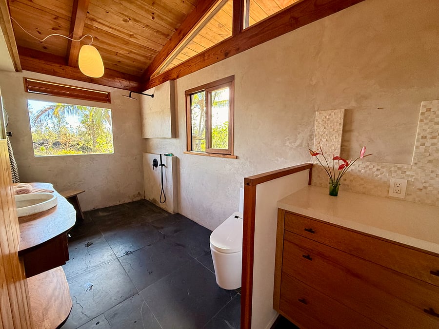 Open style shower. Heated floors for those cool mornings. The view is entirely private to State Land which is 1955 lava flow.