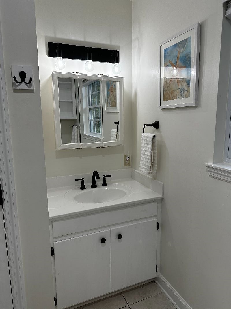 Upstairs attached bathroom with shower and closet.