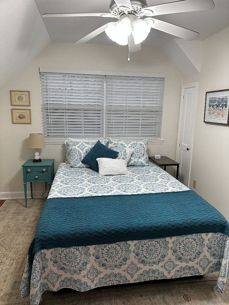 Upstairs bedroom with light filtering blinds