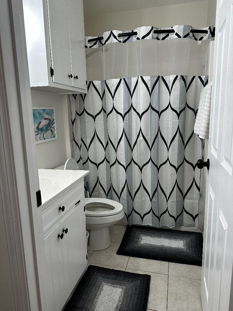 Downstairs bathroom with tub/shower combo. 