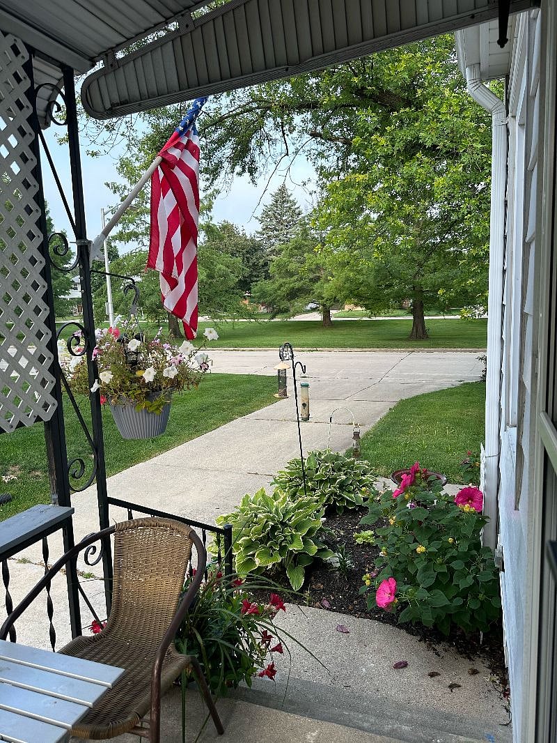 Home;
Side Porch of owner's living space.
View of Parkway & neighborhood.
76 Oak Leaf Bike Trail runs past the home and 135 miles around Milwaukee.