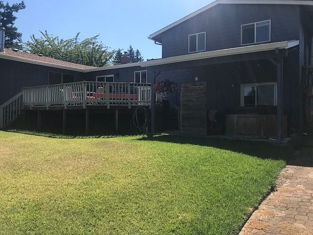 Backyard with deck and hot tub
