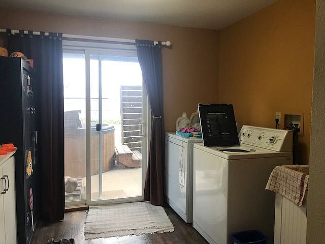 Laundry room with walk out slider to covered patio.