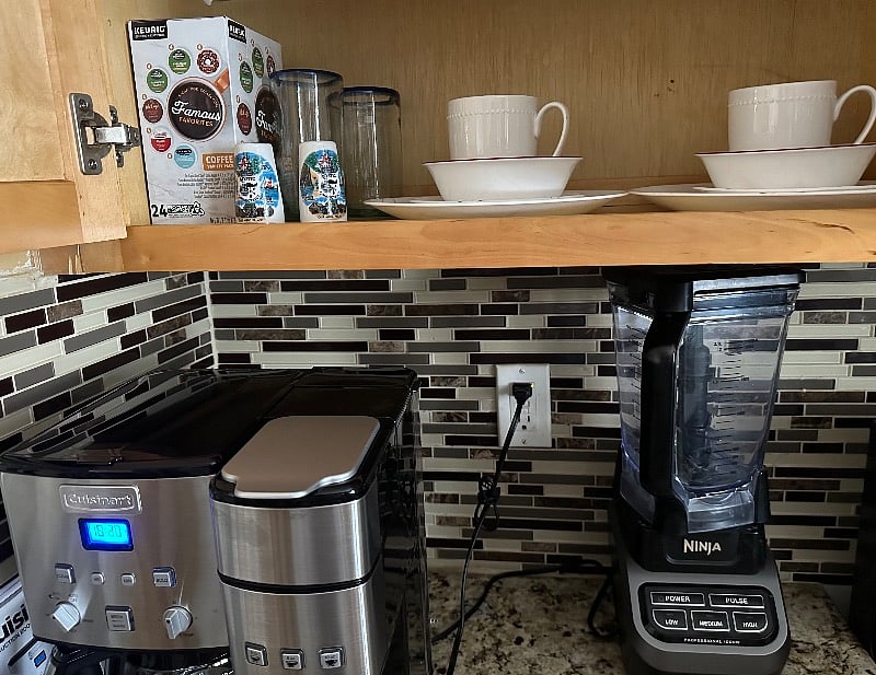 Kitchen with available appliances and dishes for use.